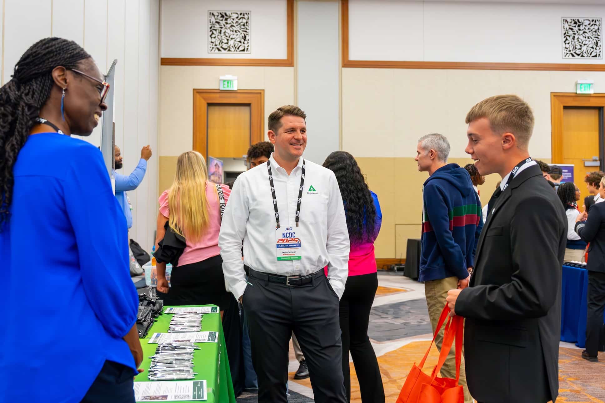 Students and professionals meeting at the JAG Career Expo