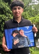 student holding picture