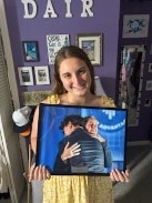 student holding a picture